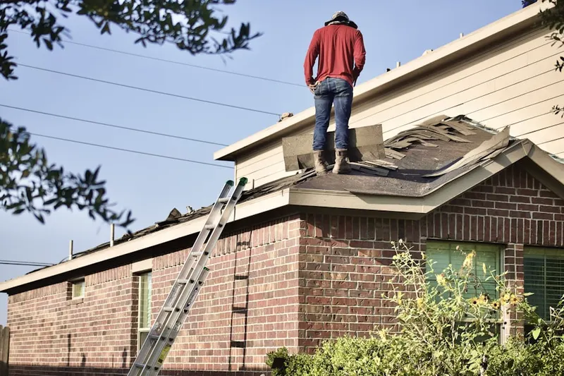 Professional roofer working on a residential roof in Mountain Views